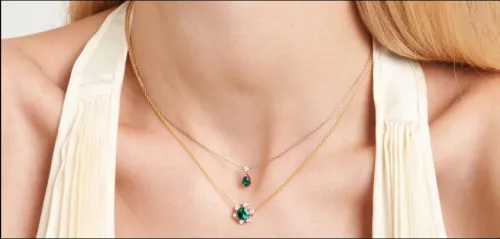 Close-up showing patina development on vintage emerald ring setting under natural light