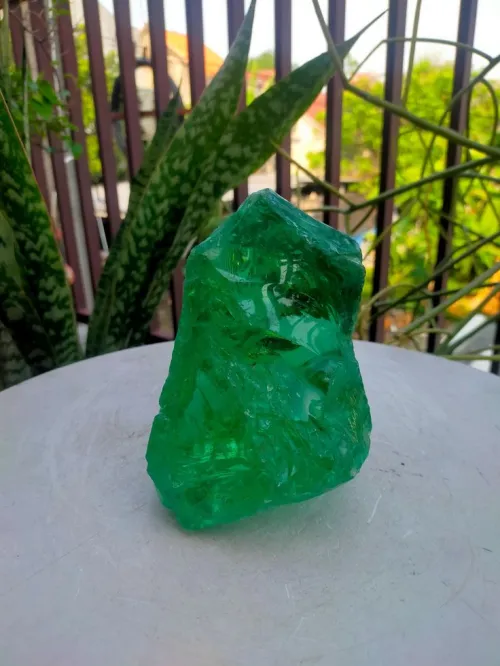 Emerald fabric swatches under different lighting conditions