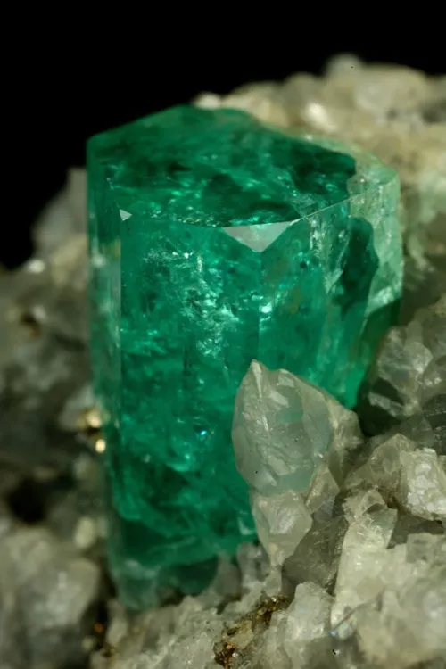 Emerald pieces interacting with different lighting conditions