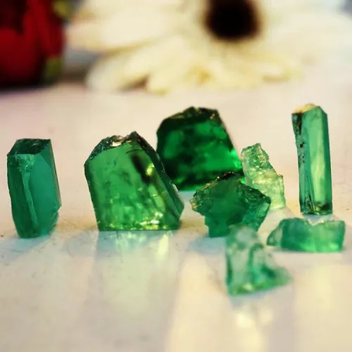 Emerald ring in varied light conditions