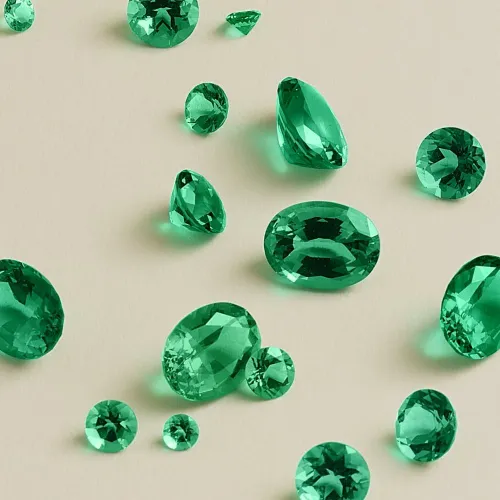 Emerald ring in various lighting conditions: daylight, soft interior, evening ambiance