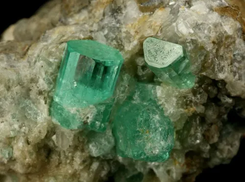 Emeralds in various settings showing light interaction