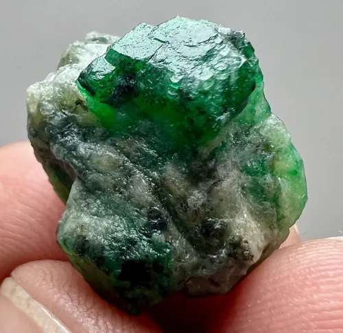 Light refracting through an emerald pendant